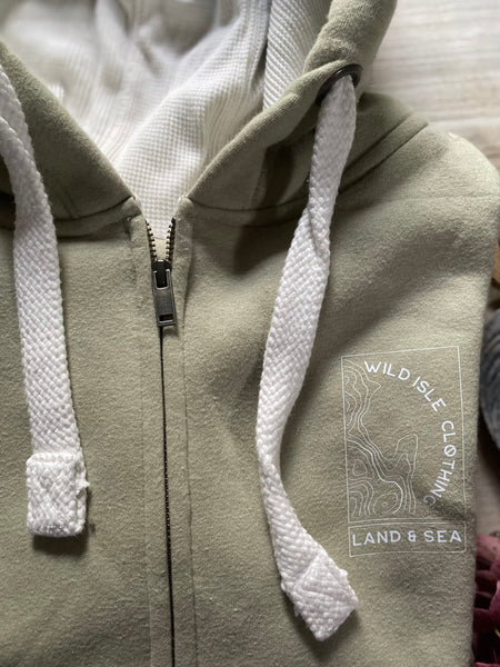 Wild Isle Clothing Sea Foam hoodie with white drawstrings and a visible brand logo on a neutral background