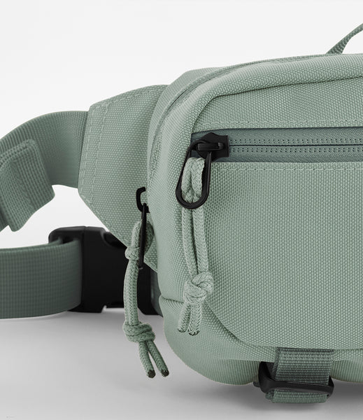 A close up of the ramble belt bag in dusty green 