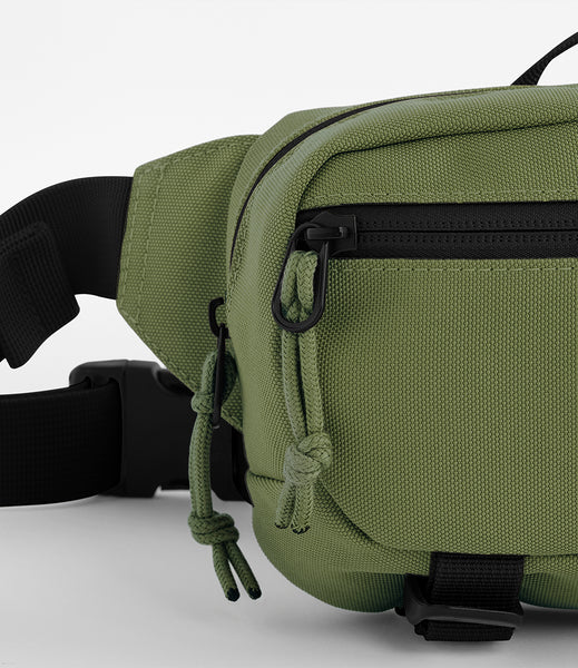A close up of the ramble belt bag in moss green 