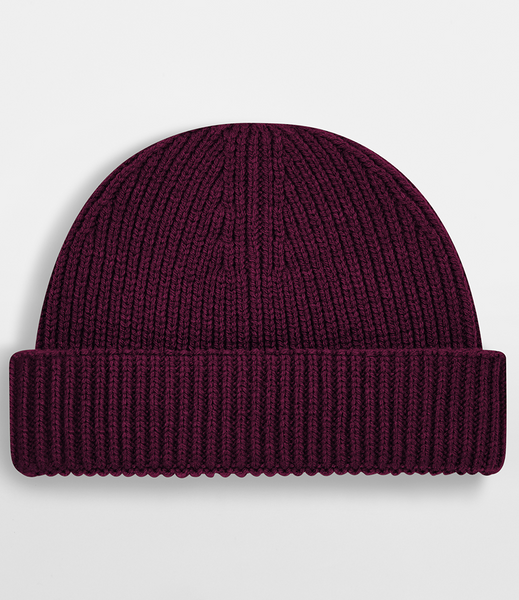 A dark burgundy ribbed knit beanie hat with a folded cuff, shown against a light gray background.