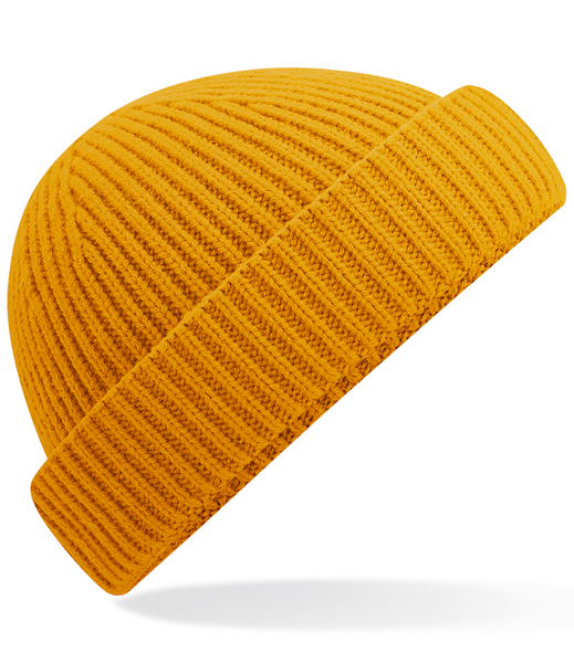 Mustard knit beanie on a white background