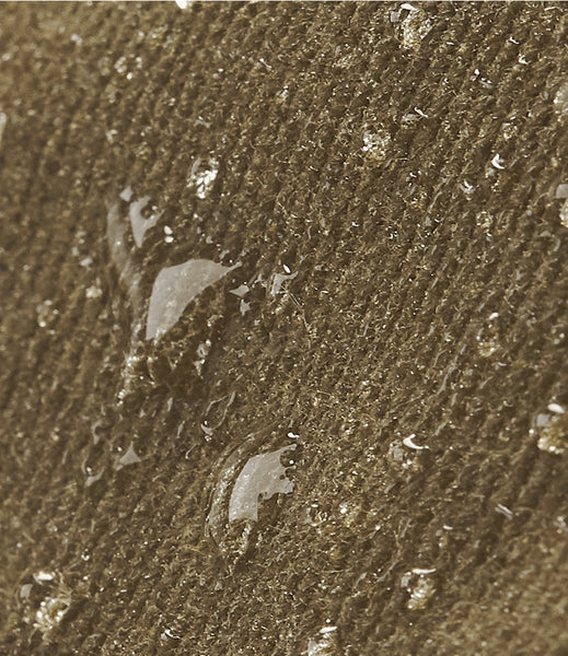 Close-up of the waxed canvas, waterproof fabric showing water repellant