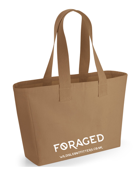 A wild isle canvas tote bag in sand colour with dual shoulder straps, featuring the name 'FORAGED' and website printed in white on the front.