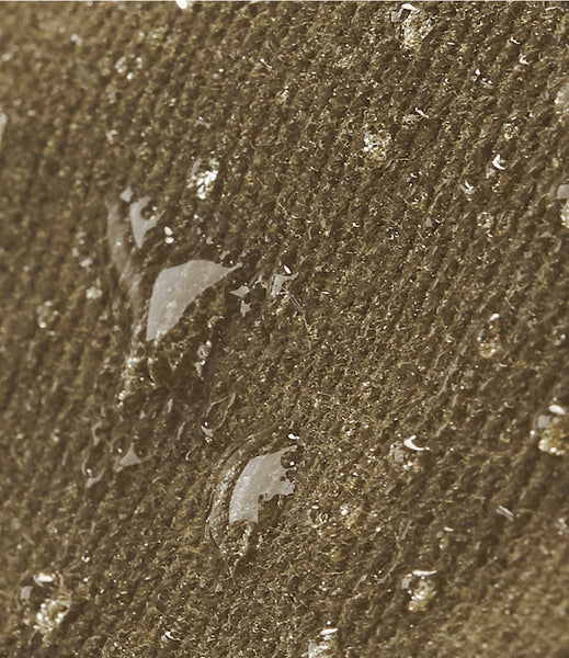 Close up of the wild isle waxed canvas sand colour - splash proof